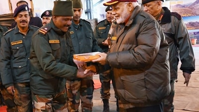 PM Modi exchanges sweets with security personnel in 2018.