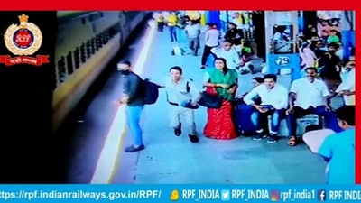 The image, taken from the Twitter video, shows one of the RPF officers running to save a woman who fell in the platform gap while deboarding a moving train. (Twitter/@RPF_INDIA)