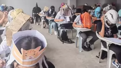Philippines students wear ‘anti-cheating’ hats during exams (Facebook) Philippines students wear ‘anti-cheating’ hats during exams (Facebook)