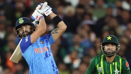 India's Virat Kohli watches as he hits a six during the T20 World Cup cricket match between India and Pakistan in Melbourne. (AP)