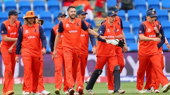 Paul van Meekeren (center) celebrates his wicket of Yasir Ali with teammates during the T20 World Cup 2022 match between Bangladesh and Netherlands at Bellerive Oval in Hobart on October 24, 2022.(AFP)