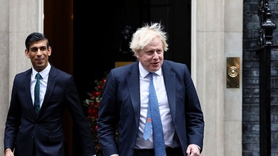 Former British Prime Minister Boris Johnson and ex-chancellor Rishi Sunak walking out of Downing Street