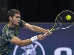 Spain's Carlos Alcaraz returns to Britain's Jack Draper