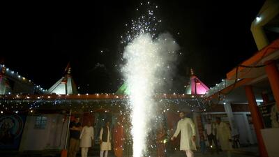 Noida, India- October 25, 2022: People burst firecrackers at a temple on the occasion of Diwali at Sanatan Dharm Mandir, Sector 19, in Noida, India, on Tuesday, October 25, 2022. (Photo by Sunil Ghosh / Hindustan Times) (Hindustan Times) Noida, India- October 25, 2022: People burst firecrackers at a temple on the occasion of Diwali at Sanatan Dharm Mandir, Sector 19, in Noida, India, on Tuesday, October 25, 2022. (Photo by Sunil Ghosh / Hindustan Times) (Hindustan Times)