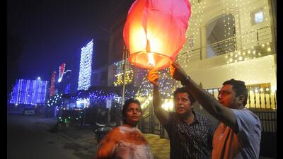 Residents celebrating Diwali at Sector 33 in Chandigarh on Monday. (Keshav Singh/HT)