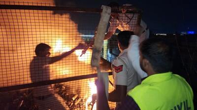 Police and firefighters attempt to douse a fire at a company at IMT Manesar in Gurugram on Tuesday. (ANI) Police and firefighters attempt to douse a fire at a company at IMT Manesar in Gurugram on Tuesday. (ANI)