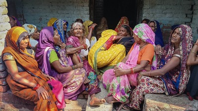 Relatives and locals mourn after two labourers were killed during a grenade attack by terrorists in Shopian district. (PTI Photo)