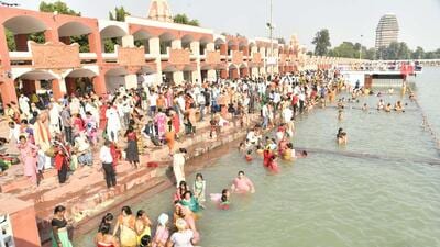 Devotees taking a holy dip in Kurukshetra’s Brahma Sarovar during a solar eclipse on Tuesday. (HT Photo) Devotees taking a holy dip in Kurukshetra’s Brahma Sarovar during a solar eclipse on Tuesday. (HT Photo)