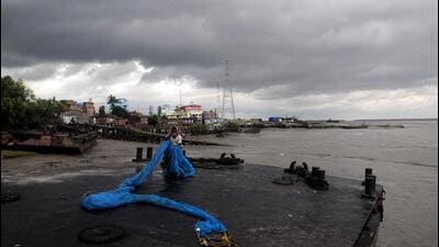Dark clouds cover the sky ahead of the landfall of Cyclone Sitrang in eastern India. (PTI Photo) Dark clouds cover the sky ahead of the landfall of Cyclone Sitrang in eastern India. (PTI Photo)