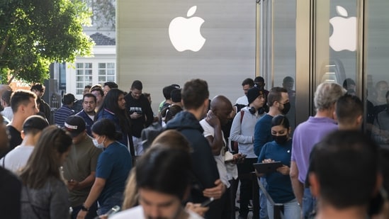 People wait in line outside an Apple Store at The Grove in Los Angeles, Friday, Sept. 16, 2022. Apple's iPhone 14 lineup and Apple Watch Series 8 are available to purchase in-store starting Friday. (AP Photo/Jae C. Hong)(AP)