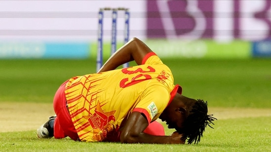 Richard Ngarava slips over and got injured during the T20 World Cup 2022 match between South Africa and Zimbabwe at Bellerive Oval in Hobart on October 24, 2022. (AFP)