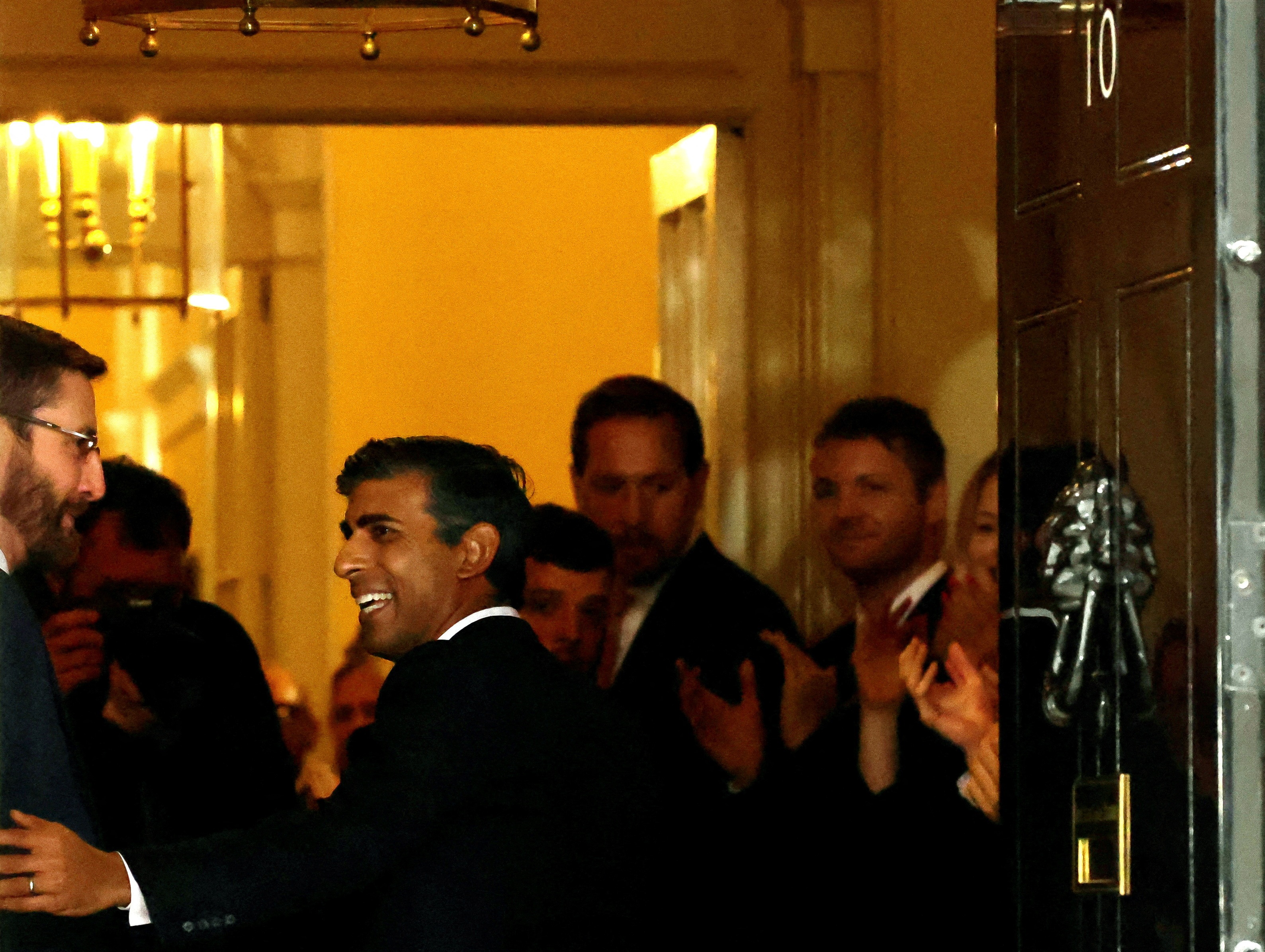Britain's new Prime Minister Rishi Sunak enters 10 Downing Street, in London, Britain, on Tuesday. (REUTERS)