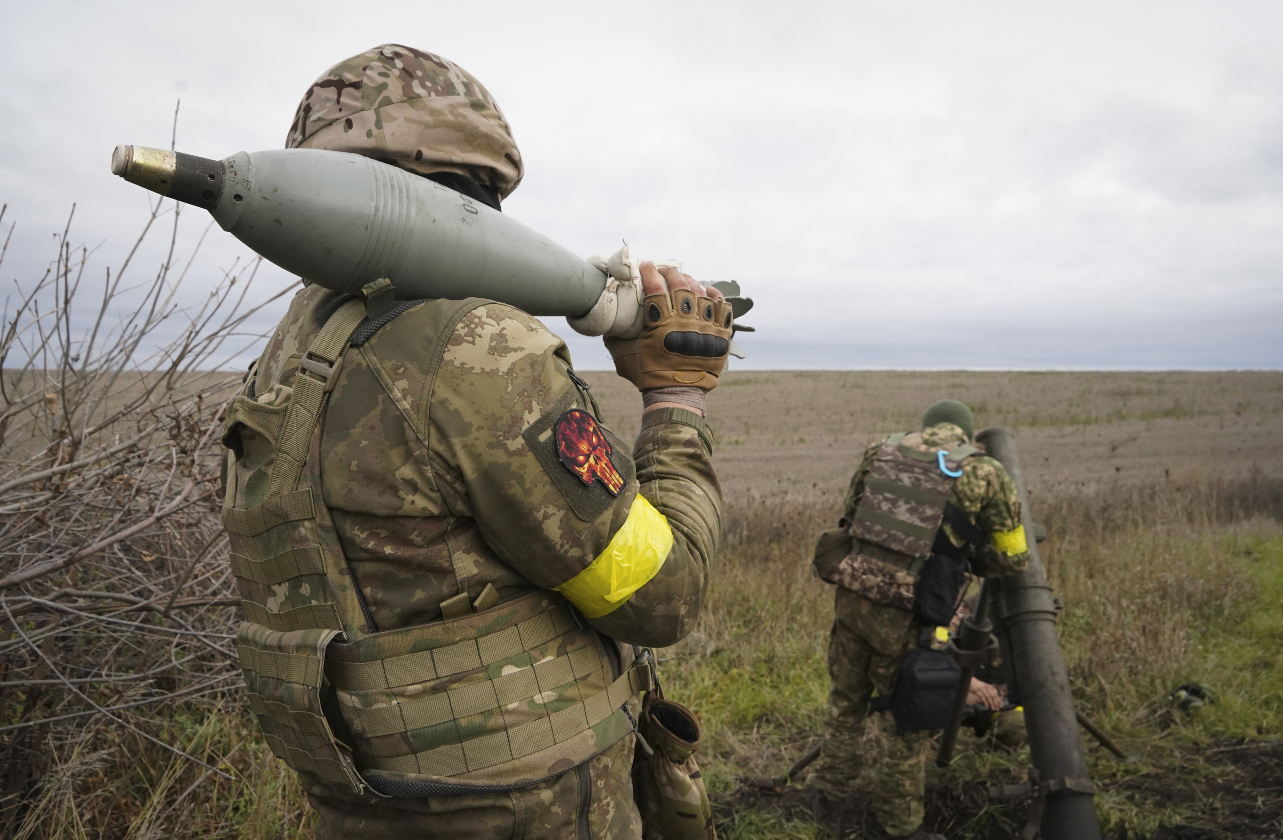 Ukrainian National guard soldiers prepare to fire at Russian positions with a mortar near Kharkiv. (AP) Ukrainian National guard soldiers prepare to fire at Russian positions with a mortar near Kharkiv. (AP)
