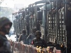 Myanmar: A soldier stand next to military vehicles.(Reuters) Myanmar: A soldier stand next to military vehicles.(Reuters)