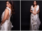 Bhumi Pednekar went all out this festive season with her looks. The actor recently stepped out to attend a Diwali party in an all-white saree draped in a unique way.(Instagram/@bhumipednekar)