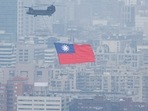 China-Taiwan Conflict: A Chinook helicopter carrying a Taiwan flag flies over the city during the country's National Day celebration in Taipei, Taiwan.