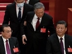 China’s President Xi Jinping (right) sits besides Premier Li Keqiang (left) as former president Hu Jintao (centre) is assisted to leave from the closing ceremony of the 20th China's Communist Party's Congress at the Great Hall of the People in Beijing. (AFP) China’s President Xi Jinping (right) sits besides Premier Li Keqiang (left) as former president Hu Jintao (centre) is assisted to leave from the closing ceremony of the 20th China's Communist Party's Congress at the Great Hall of the People in Beijing. (AFP)