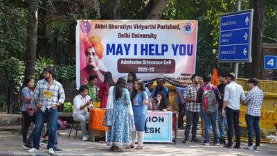 Students set up a help desk for admission seekers under the new CUET process of Delhi University at North Campus. (PTI) Students set up a help desk for admission seekers under the new CUET process of Delhi University at North Campus. (PTI)