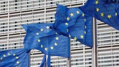 European Union flags flutter outside the EU Commission headquarters in Brussels, Belgium. (Reuters)