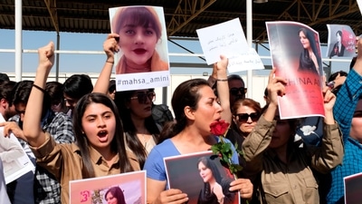 Protesters gather outside the UN headquarters in Irbil, Iraq, on Sept. 24, 2022. (AP)