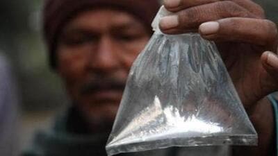 A villager shows a packet of 'hooch'. (Subhendu Ghosh/ HT File Photo) A villager shows a packet of 'hooch'. (Subhendu Ghosh/ HT File Photo)