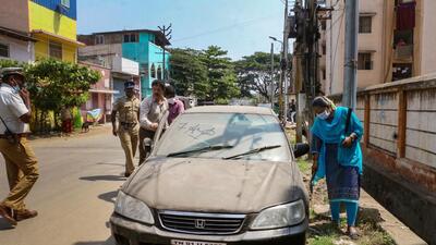 Security personnel check a parked vehicle in Coimbatore on Wednesday. (PTI)