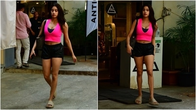Janhvi teamed the crop top with black-coloured workout shorts and rounded it all off with a printed tote bag and beige slip-on sandals. (HT Photo/Varinder Chawla) Janhvi teamed the crop top with black-coloured workout shorts and rounded it all off with a printed tote bag and beige slip-on sandals. (HT Photo/Varinder Chawla)
