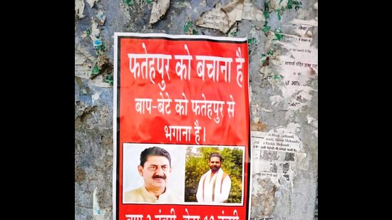 Posters put up in Fatehpur assembly segment against BJP candidate Rakesh Pathania. (HT Photo)