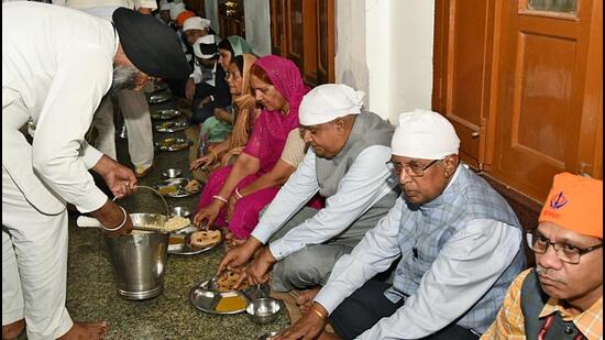 The langar at Golden Temple gives you a glimpse of a world of equality, where several hundreds of devotees from almost everywhere, relish the same meal, sitting together, making a colourful ocean. (Above) Indian vice president Jagdeep Dhankar with his wife Sudesh Dhankhar eats langar during their visit to Golden Temple, in Amritsar. (ANI) The langar at Golden Temple gives you a glimpse of a world of equality, where several hundreds of devotees from almost everywhere, relish the same meal, sitting together, making a colourful ocean. (Above) Indian vice president Jagdeep Dhankar with his wife Sudesh Dhankhar eats langar during their visit to Golden Temple, in Amritsar. (ANI)