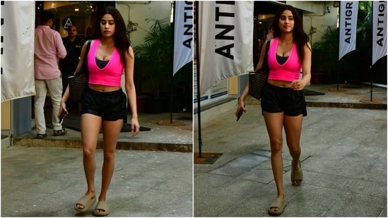 On Wednesday, the paparazzi clicked Janhvi Kapoor outside her gym studio in Mumbai. The star wore a stylish crop top and shorts for the rigorous session and proved one can look incredible even while sweating it out. Keep scrolling to check out more pictures of Janhvi at the gym. (HT Photo/Varinder Chawla)