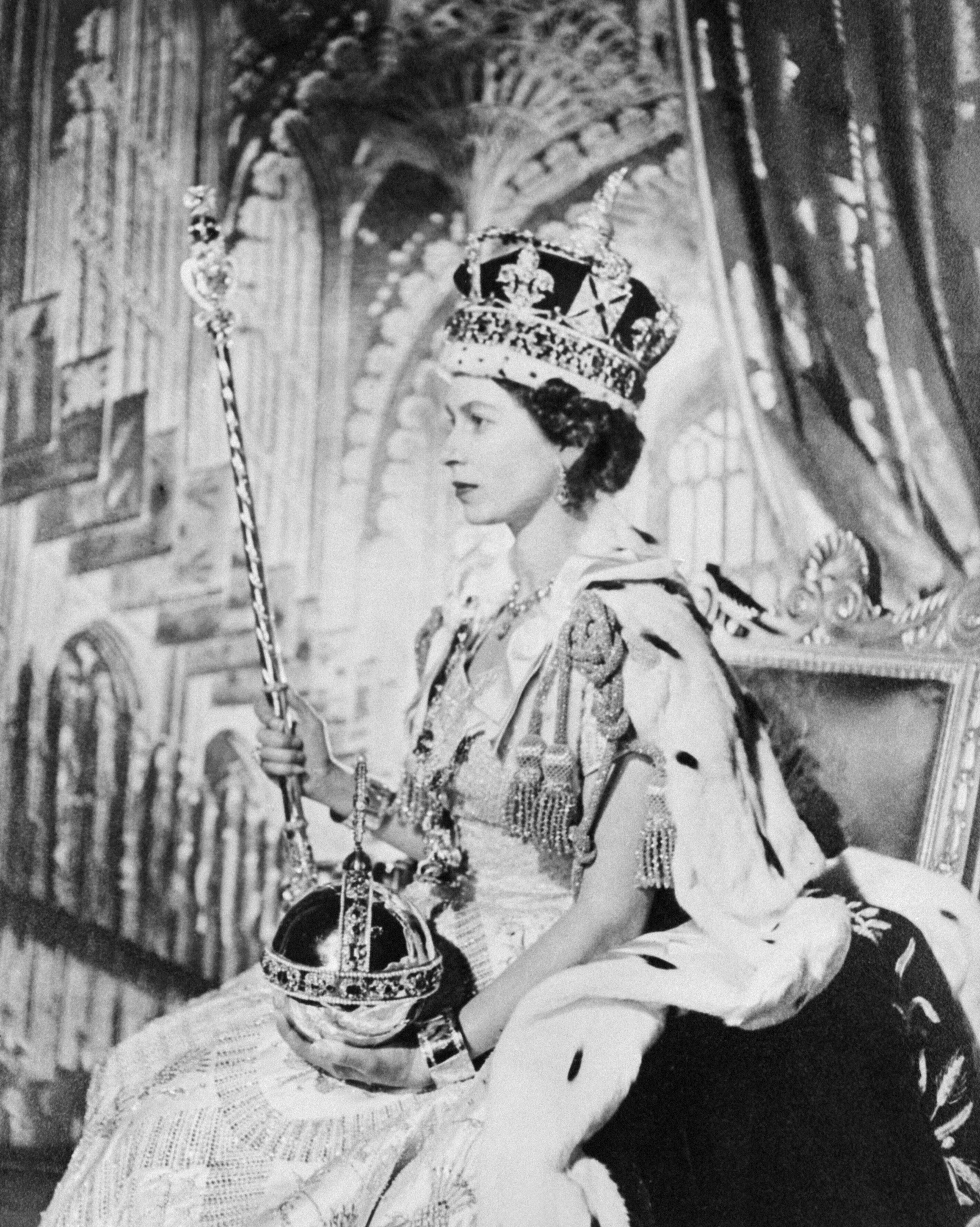 (FILES) In this file photo taken on June 2, 1953 Queen Elizabeth II of Great Britain poses on her Coronation day, in London. - The coronation of King Charles III will take place on May 6, 2023, Buckingham Palace announced on October 11, 2022. The Crown Jewels will form the centrepiece of King Charles III's coronation, and symbolise the power and history of the British monarchy. (Photo by INTERCONTINENTALE / AFP)(AFP)