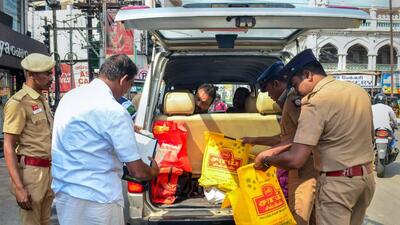 Security personnel check a vehicle in Coimbatore on Wednesday. (PTI) Security personnel check a vehicle in Coimbatore on Wednesday. (PTI)