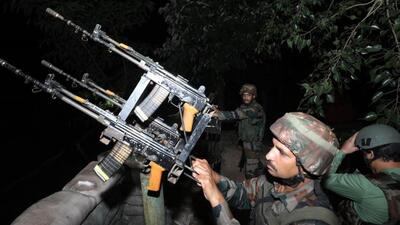 A soldier stands behind multi weapon platform and another behind aqua jammer (camouflaged) at the LoC in Jammu. (HT Photo) A soldier stands behind multi weapon platform and another behind aqua jammer (camouflaged) at the LoC in Jammu. (HT Photo)