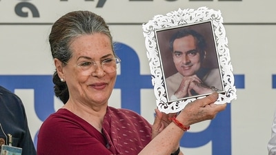 Mallikarjun Kharge presented the framed photo of Rajiv Gandhi to Sonia Gandhi as he took charge of the party as the new elected chief. (PTI) Mallikarjun Kharge presented the framed photo of Rajiv Gandhi to Sonia Gandhi as he took charge of the party as the new elected chief. (PTI)
