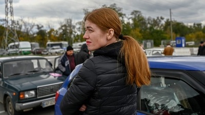 Russia-Ukraine War A Ukrainian woman looks on at a check point in Zaporizhzhia. (AFP)