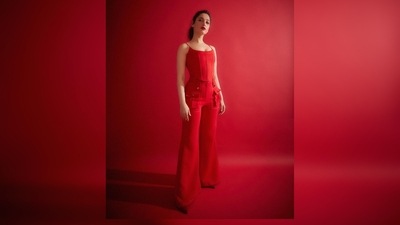 Tamannaah Bhatia's outfit comprises a corset inspired red strappy top and flared multi-pocket trousers. (Instagram/@tamannaahspeaks) Tamannaah Bhatia's outfit comprises a corset inspired red strappy top and flared multi-pocket trousers. (Instagram/@tamannaahspeaks)
