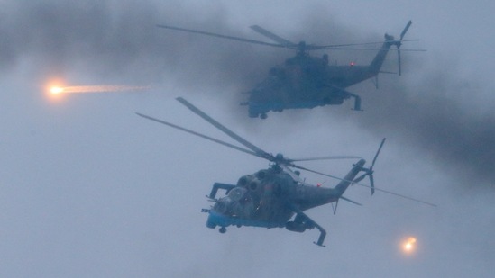 Russia-Ukraine War: Military helicopters fly over the Osipovichi training ground during Russia-Belarus military drills. (AP)