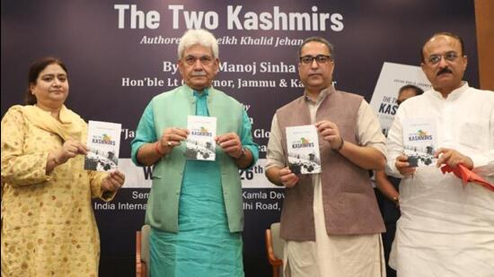 Jammu and Kashmir Lieutenant Governor Manoj Sinha (centre) at ‘The Two Kashmirs’ book launch with author Sheikh Khalid Jahangir in Srinagar on Wednesday.