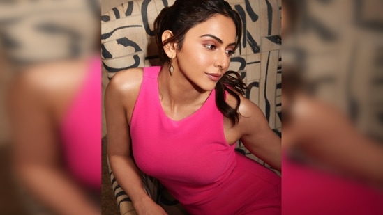 Rakul Preet struck some stunning posing on a huge beige and black chair with matching pillows on the floor.(Instagram/@rakulpreet)