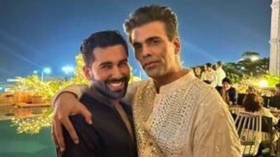 Filmmaker Karan Johar held Orhan Awatramani as they posed for a picture. For the occasion, Karan opted for a cream and silver ethnic wear. Instagram/Orhan Awatramani