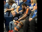 Coal miner watching a game with his son.(Twitter/@UKCoachCalipari) Coal miner watching a game with his son.(Twitter/@UKCoachCalipari)