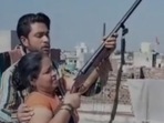 In a video, the man can be seen firing several rounds of a double-barreled gun and making his sister, brother, and mother do the same.
