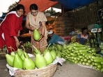 Women purchase bottle gourd at a vegetable market for 'Nahai-Khai' ritual in Bihar. The origin of this festival dates back to Ramayana. Some legends also say that Mahabharata's Karna - king of Anga - modern day Bhagalpur in Bihar - also performed Chhath puja and so did Pandavas and Draupadi.(Santosh Kumar/ Hindustan Times)