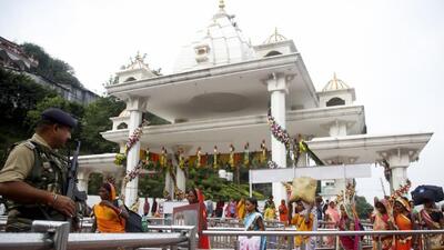 A CRPF personnel stands guard outside the gate of the Vaishno Devi shrine in Katra, Jammu. (PTI File Photo)