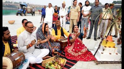 Deputy chief minister Brajesh Pathak, along with his wife, performing ‘nahay khay’ ritual as a part of Chhath Puja. at Laxman Mela Ground in Lucknow, on Friday. (Deepak Gupta/HT Photo)