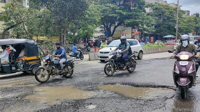 Potholes on a road at Bibvewadi in Pune. (HT FILE PHOTO)