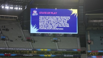 A scoreboard screen displays the announcement that the T20 World Cup cricket match between Australia and England as abandoned due to rain in Melbourne. (AP) A scoreboard screen displays the announcement that the T20 World Cup cricket match between Australia and England as abandoned due to rain in Melbourne. (AP)