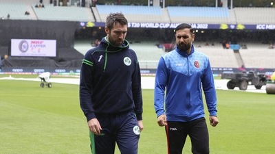 Ireland's captain Andrew Balbirnie, left, and Afghanistan's captain, Mohammad Nabi walk from the field after their match was abandoned due to rain at the T20 World Cup cricket in Melbourne (AP) Ireland's captain Andrew Balbirnie, left, and Afghanistan's captain, Mohammad Nabi walk from the field after their match was abandoned due to rain at the T20 World Cup cricket in Melbourne (AP)