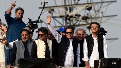 Former Pakistan prime minister Imran Khan gestures during an anti-government long march towards Islamabad to demand early elections, in Lahore, on Friday. (AFP) Former Pakistan prime minister Imran Khan gestures during an anti-government long march towards Islamabad to demand early elections, in Lahore, on Friday. (AFP)