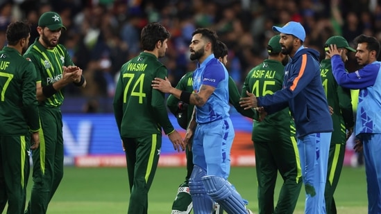 India's Virat Kohli shakes hands with Pakistan's Mohammad Wasim following the T20 World Cup cricket match between India and Pakistan in Melbourne (AP)